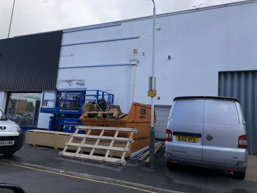 Click Here To Enlarge This Photo Of REFURBISHMENT Overclad existing Masonry Walls with 0.7mm Thick Pre Coated Black Prisma, Ral 9005 Galvanised Steel Profile Vertical Cladding