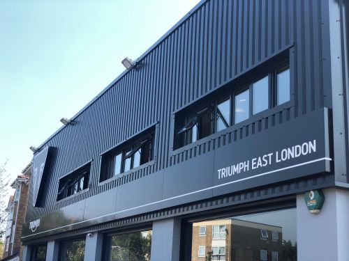 Click Here To Enlarge This Photo Of REFURBISHMENT Overclad existing Masonry Walls with 0.7mm Thick Pre Coated Black Prisma, Ral 9005 Galvanised Steel Profile Vertical Cladding