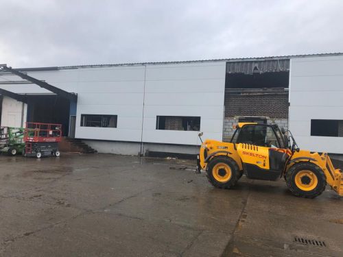 Click Here To Enlarge This Photo Of REFURBISHMENT Overclad existing front elevation with Kingspan KS1000