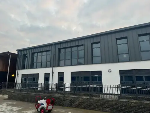 Click Here To Enlarge This Photo Of Ash & Lacy Ashzip 400mm flat pan built up aluminium Standing Seam Roofing & Cladding System in Slate Grey for a private school in London