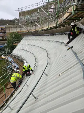 Click Here To Enlarge This Photo Of Euroclad Elite 4 Range aluminium tapered Standing Seam built up Roofing System in Slate Grey to 2 no. roofs for a valued client in Dover, Kent.