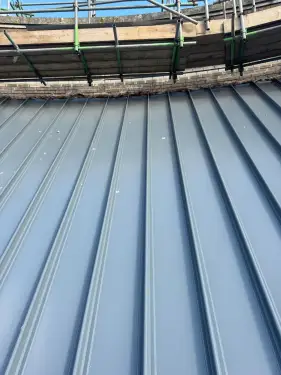 Click Here To Enlarge This Photo Of Euroclad Elite 4 Range aluminium tapered Standing Seam built up Roofing System in Slate Grey to 2 no. roofs for a valued client in Dover, Kent.