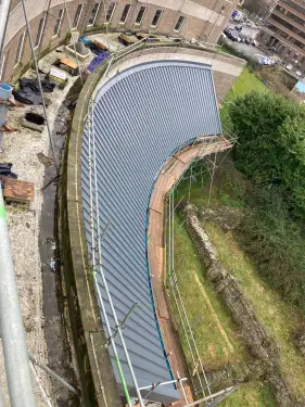 Click Here To Enlarge This Photo Of Euroclad Elite 4 Range aluminium tapered Standing Seam built up Roofing System in Slate Grey to 2 no. roofs for a valued client in Dover, Kent.