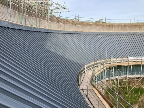 Click Here To Enlarge This Photo Of Euroclad Elite 4 Range aluminium tapered Standing Seam built up Roofing System in Slate Grey to 2 no. roofs for a valued client in Dover, Kent.